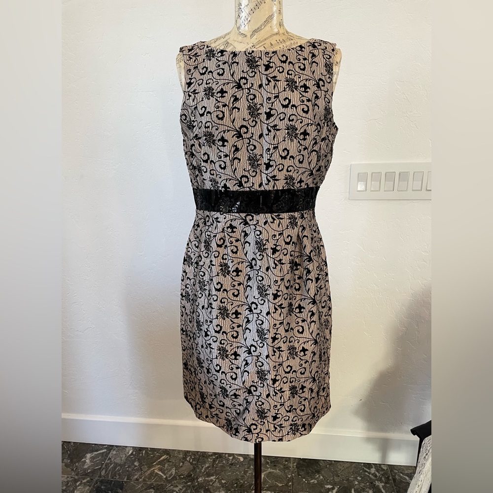 Perfect party dress with sequined waist band.